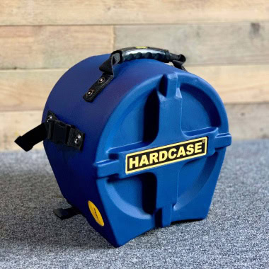 Hardcase blue protective shell for snare drums with secure straps and handle.
