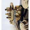Gold and black brass snare drum with hardware, high-quality drum hardware for professional drummers.