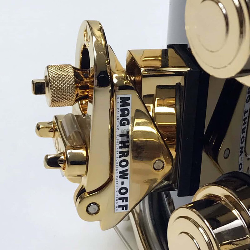 Gold and black brass snare drum with hardware, high-quality drum hardware for professional drummers.
