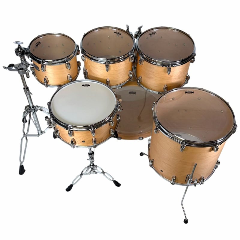 Professional wooden drum set with cymbals, hardware, and drumsticks for drumming enthusiasts.