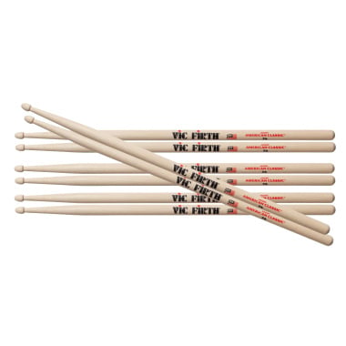 Set of four Vic Firth 7A hickory drumsticks with wood tips.