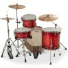 Red drum kit with cymbals for drumming performance.