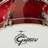 Close-up of Gretsch Catalina Club drum with logo and red finish.