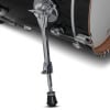 Close-up of drum kit leg and shell with chrome hardware.