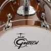 Close-up of Gretsch Catalina Jazz drum with bronze sparkle finish.