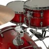Red drum kit with cymbals and hardware for music performance.
