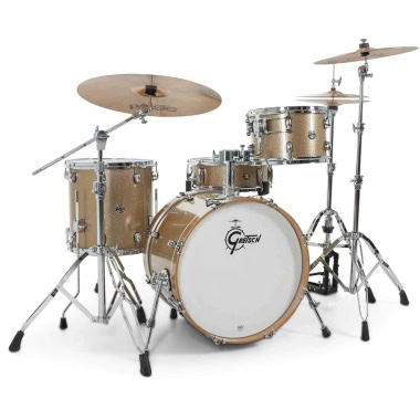 Gold drum kit with cymbals and hardware for drumming performances.