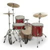 Red drum kit with cymbals and hardware for drumming.
