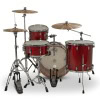 Red drum kit with cymbals for drumming performances.