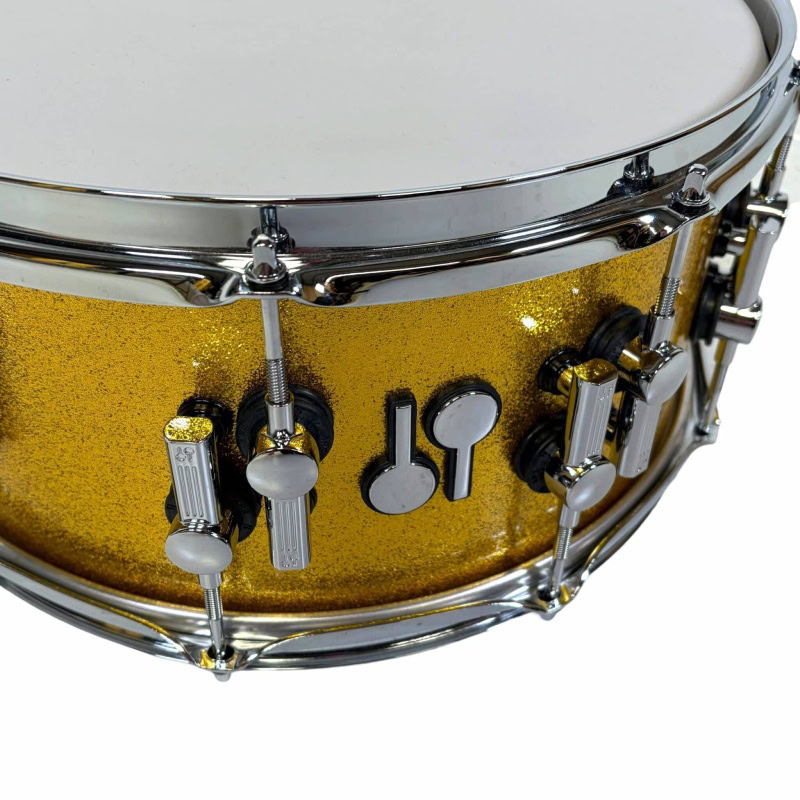 High-quality Sonor SQ2 14x6.5 inch Birch Snare Drum with a stunning gold sparkle finish.