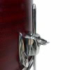 Drum hardware lock with drumstick holder, chrome finish, mounted on wooden drum kit.