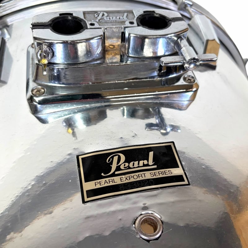 Pearl Export Series drum hardware with chrome finish and mounting clamp.