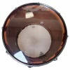 Snare drum with transparent shell, showcasing drum hardware and interior components.