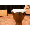 Close-up of a wooden conga drum on stage at Drummers Only event.