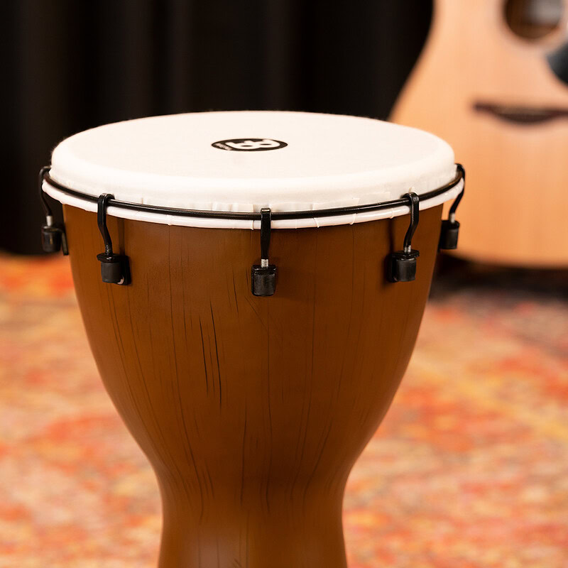 Close-up of a wooden conga drum on stage at Drummers Only event.