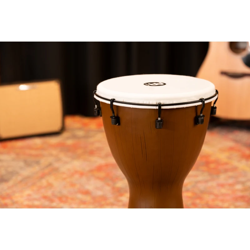 Close-up of a wooden conga drum on stage at Drummers Only event.