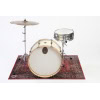 Drum kit with cymbals and snare on decorative rug for drumming practice.