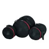 Professional black drum bag set with red accents for drum gear transport.