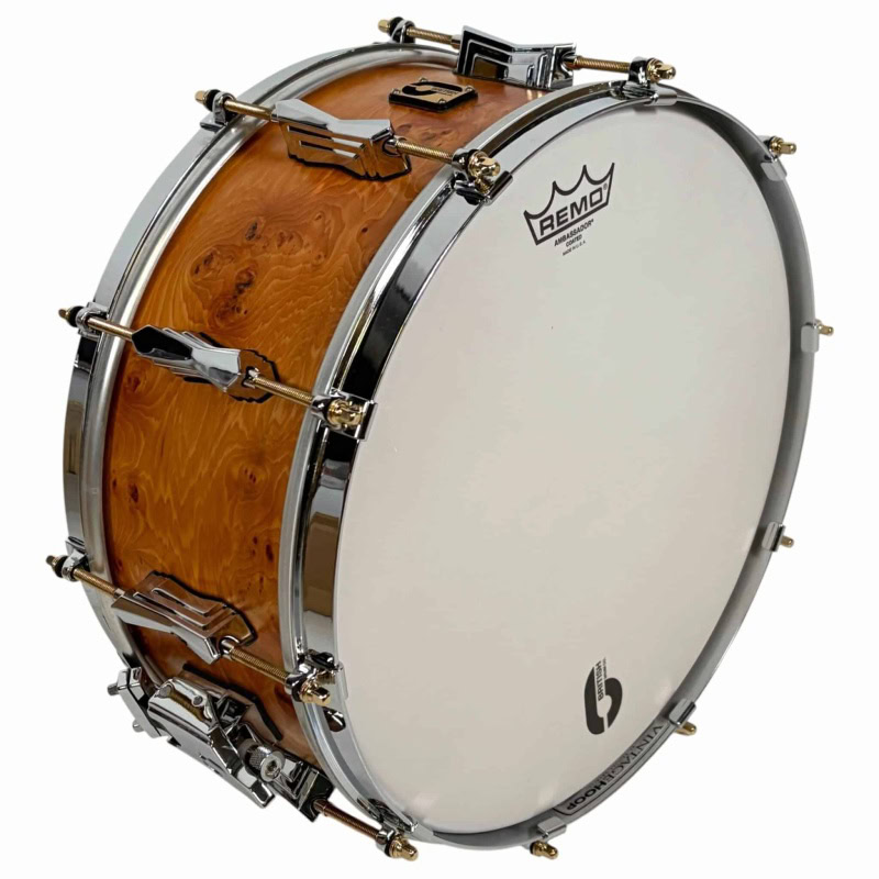 Snare drum by British Drum Company, model 'The Archer', 14x6 inches, with wooden shell and chrome ha.