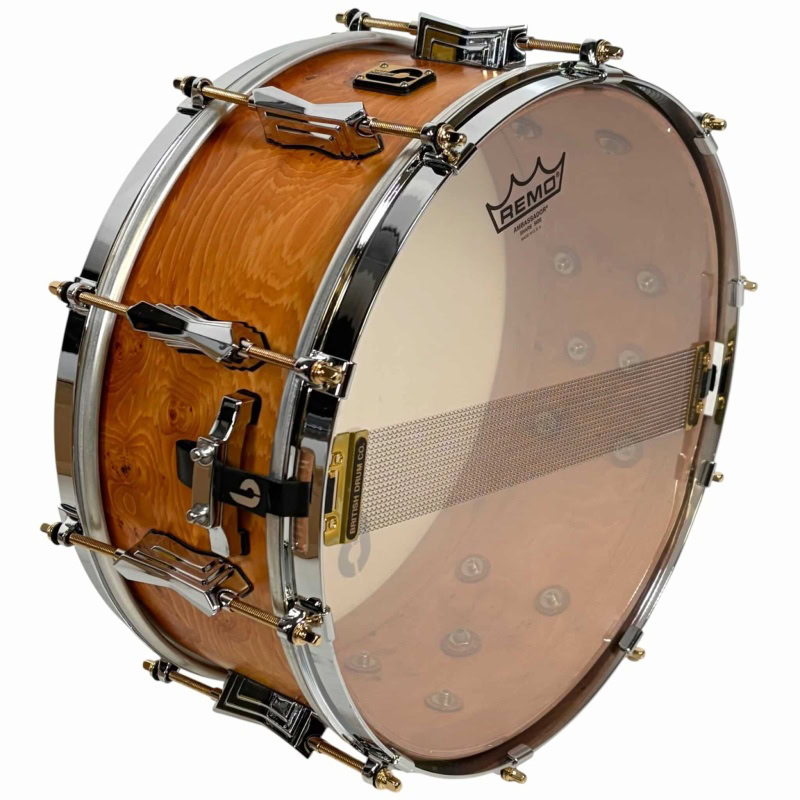Snare drum by British Drum Company, model 'The Archer', 14x6 inches, with natural wood finish.