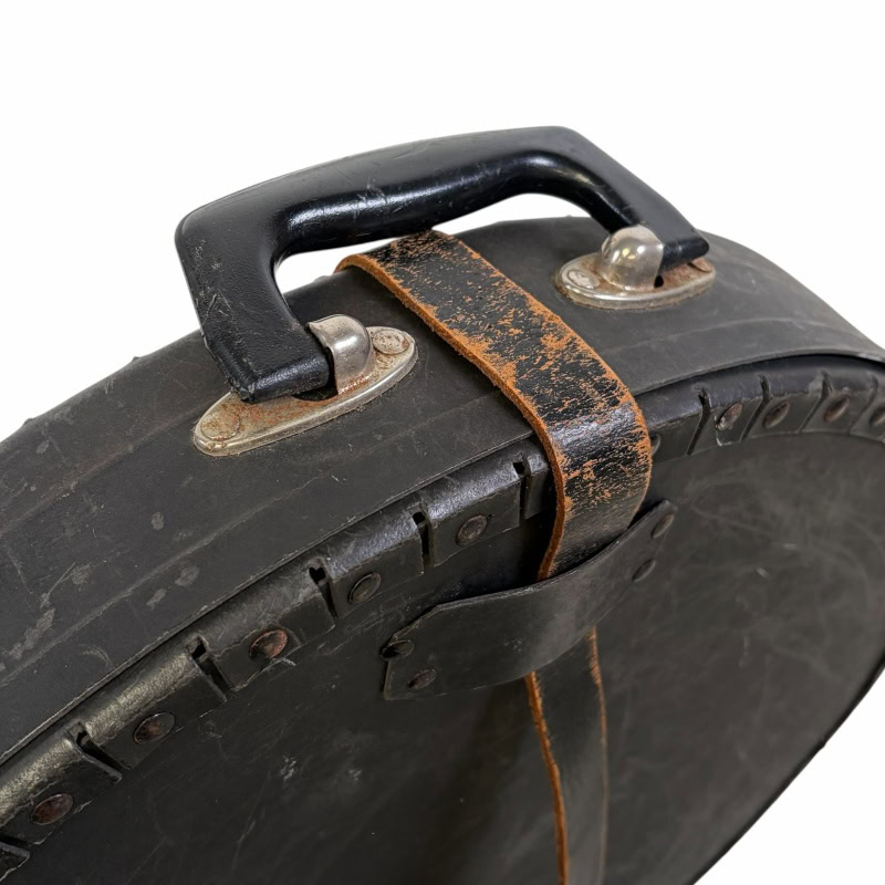 Vintage cymbal case with leather strap and metal handle for drummers. Durable, protective drum equip.