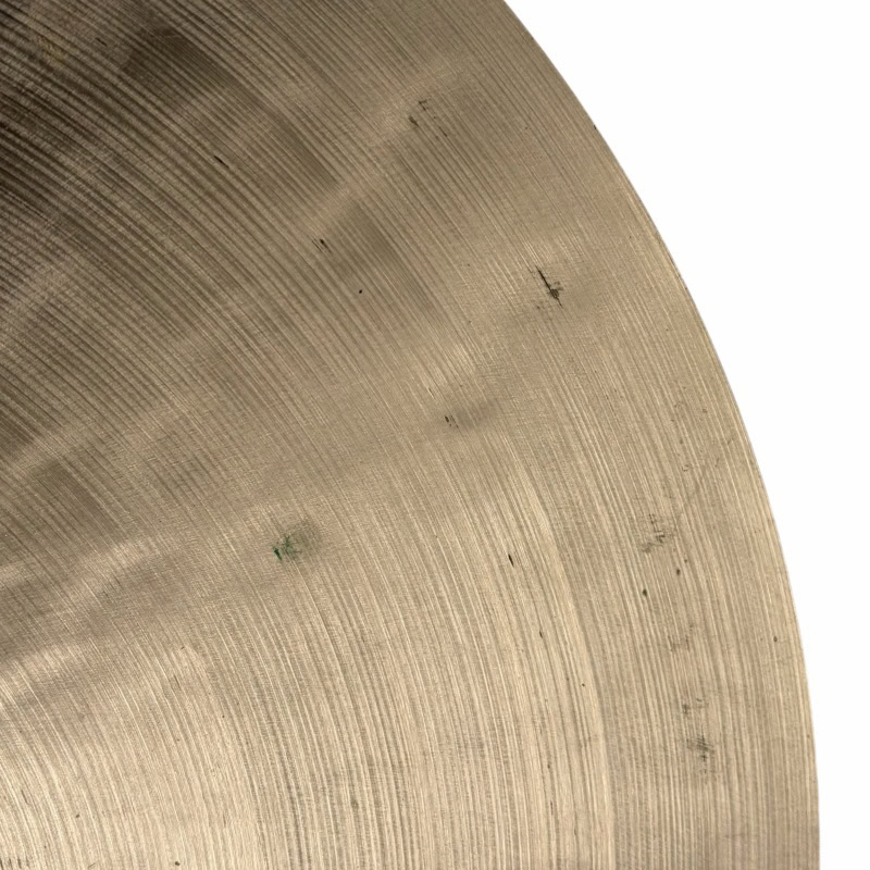 Cymbal close-up showing detailed surface texture and concentric circles, ideal for drum and percussi.