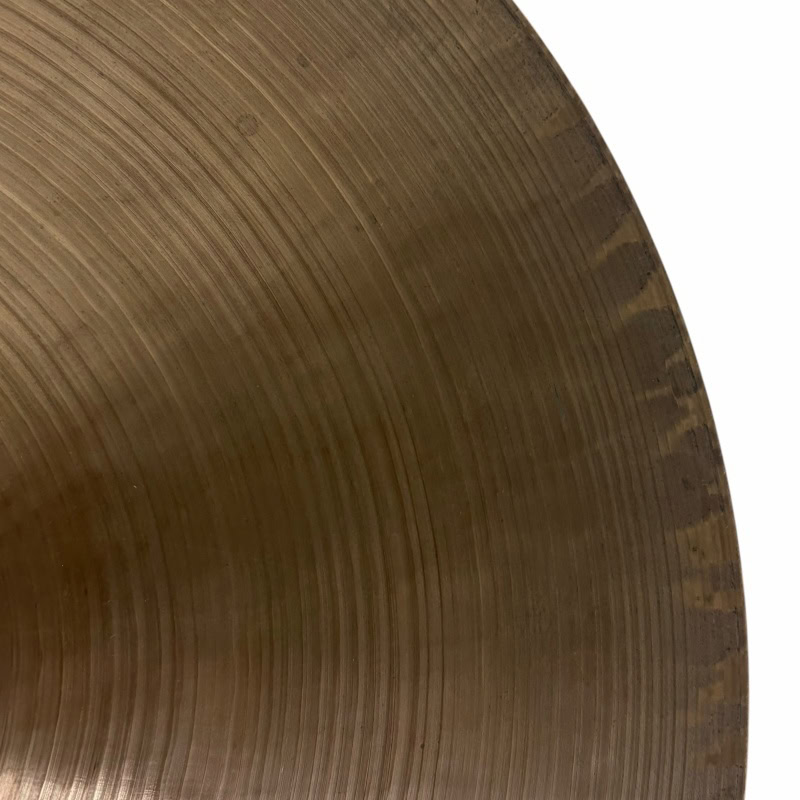 Cymbal close-up showing detailed grooves and metallic finish, ideal for drumming enthusiasts and mus.