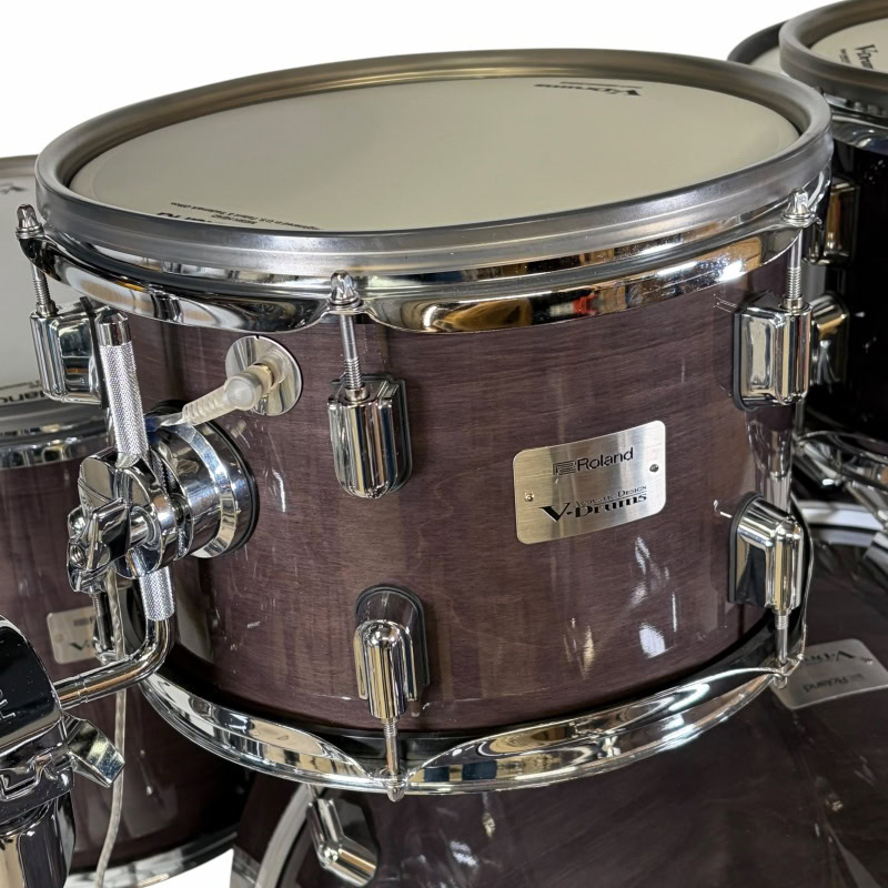 High-quality wooden snare drum with chrome hardware for professional drumming.
