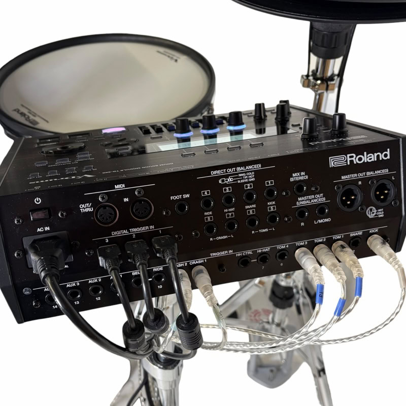 Roland electronic drum kit with mixer and accessories for drummers.