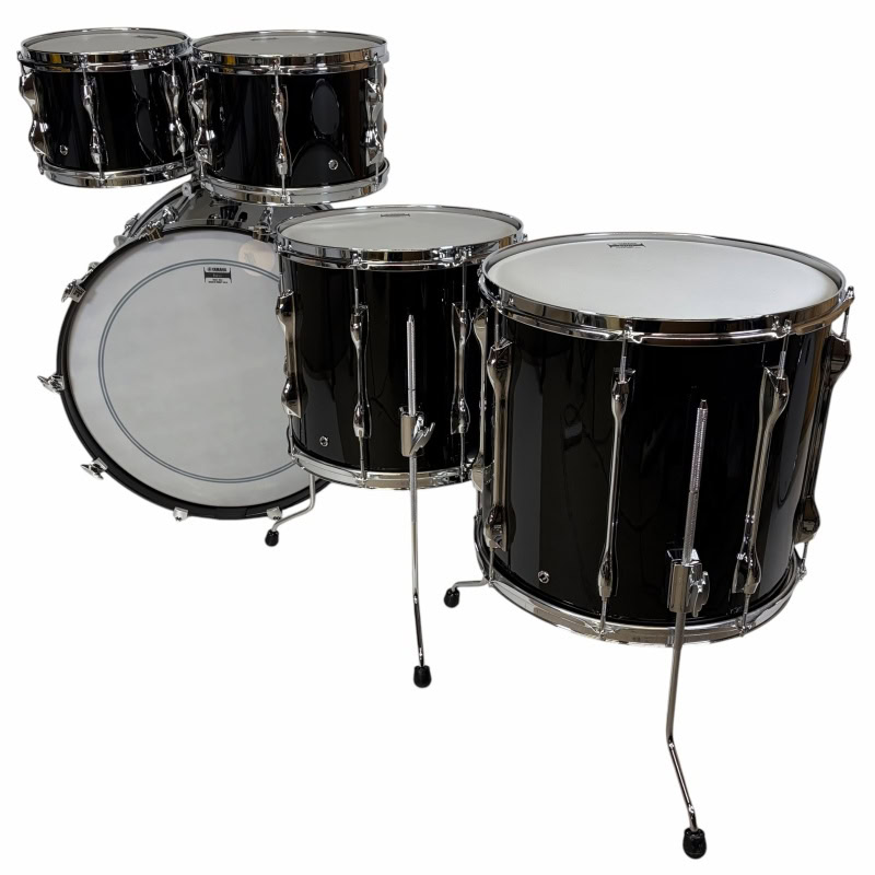 Black drum kit with bass, snare, and tom drums for drumming enthusiasts.