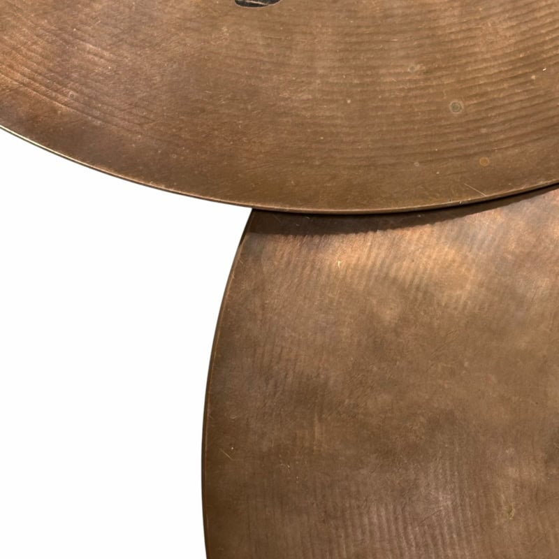Close-up of Drummers Only logo on vintage cymbals for drumming enthusiasts.
