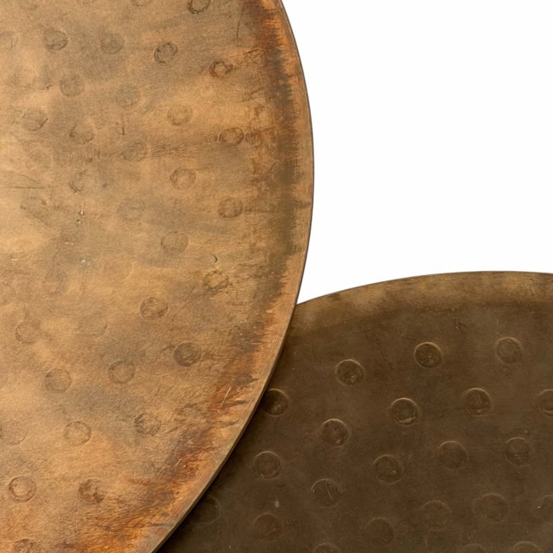 Vintage percussion instruments with textured surfaces and circular indentations.