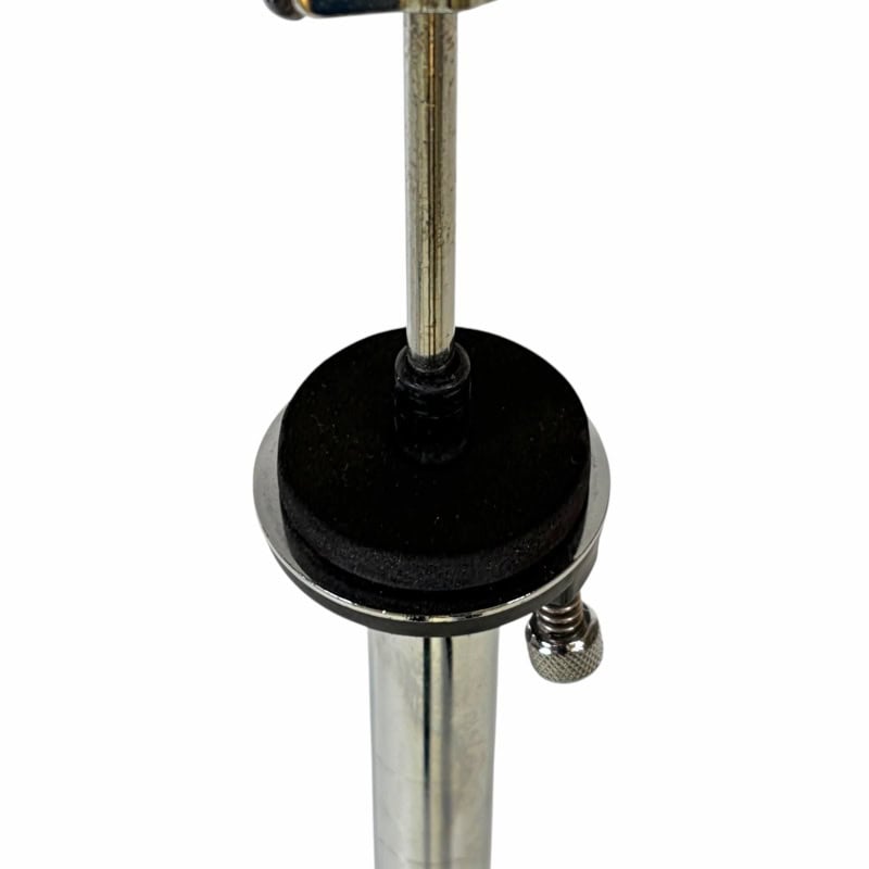 Close-up of a drum key stand with a drum key attached, used for tuning drums.