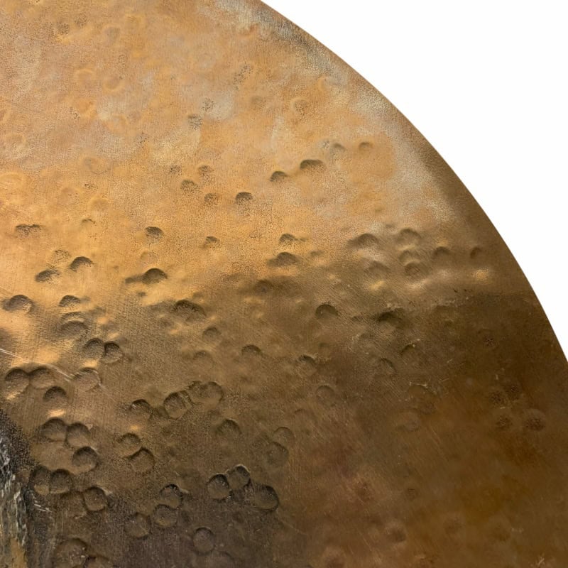 Close-up of a drum with textured surface and Drummers Only logo in focus.