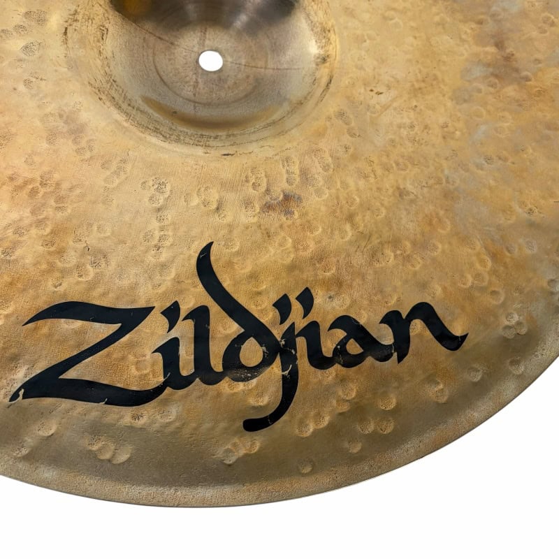 Close-up of Zildjian cymbal showcasing its textured surface and logo.
