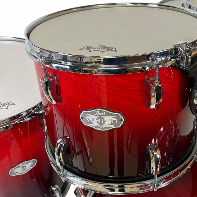 Professional red drum kit for drumming enthusiasts and performances.