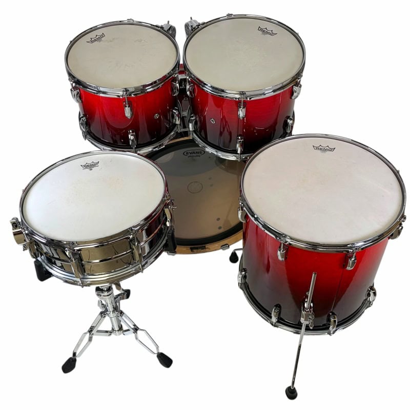 Red drum kit with snare, toms, and cymbals for professional drumming. Perfect for drummers and music.
