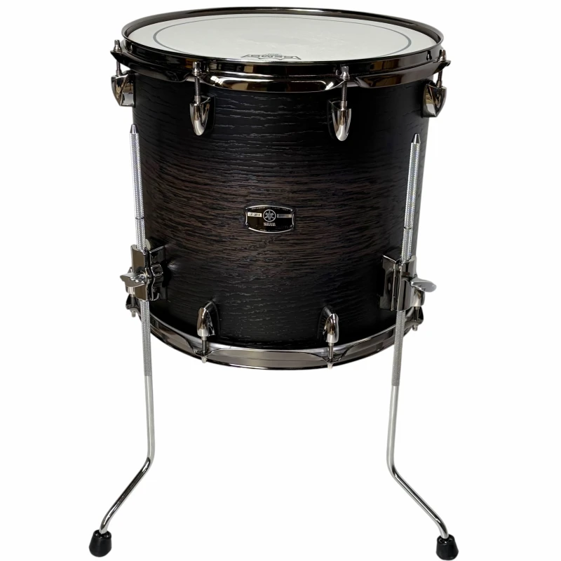 Black snare drum on stand, perfect for drumming practice and performances.