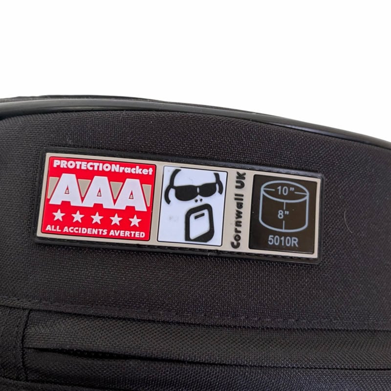 Protection sticker on drum bag for safety and durability.