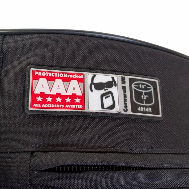 Drum bag with AAA protection and safety warning label for drummers.