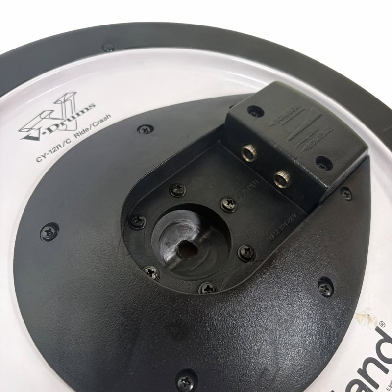 Close-up of electronic drum module mount for drum kit setup.