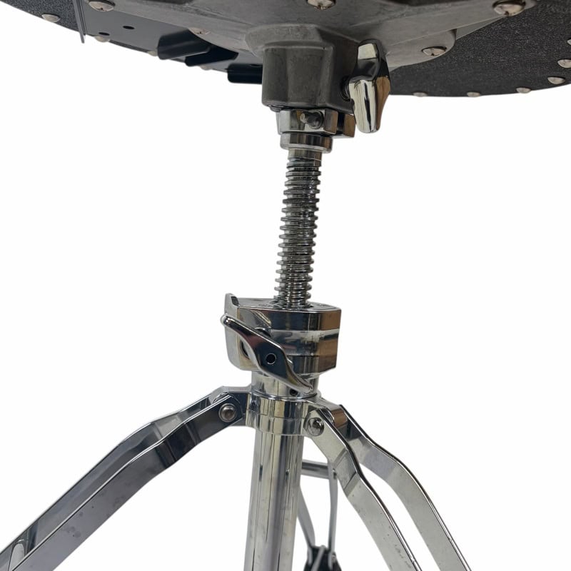 Close-up of drum throne height adjustment mechanism and hardware for drummers.