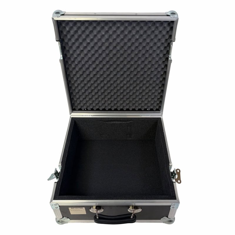 Hard drum case with foam padding for secure instrument transport.
