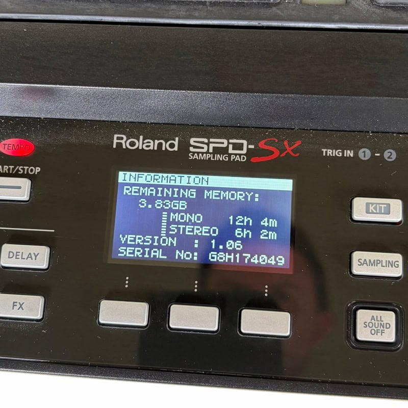 Roland SPD-SX sampling pad for drummers, featuring digital display and multiple control buttons.