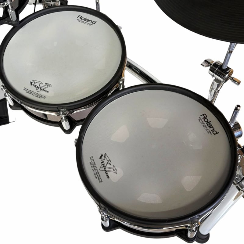 Electronic drum kit with Roland pads and cymbals for professional drumming practice and performances.