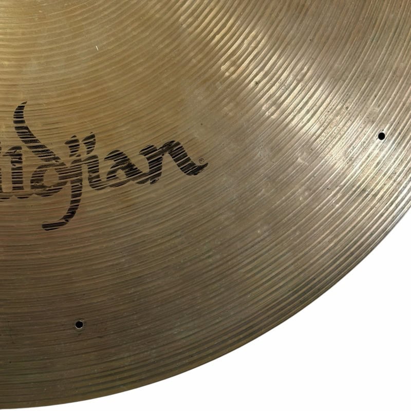 Close-up of a Zildjian cymbal showcasing its textured surface and logo.