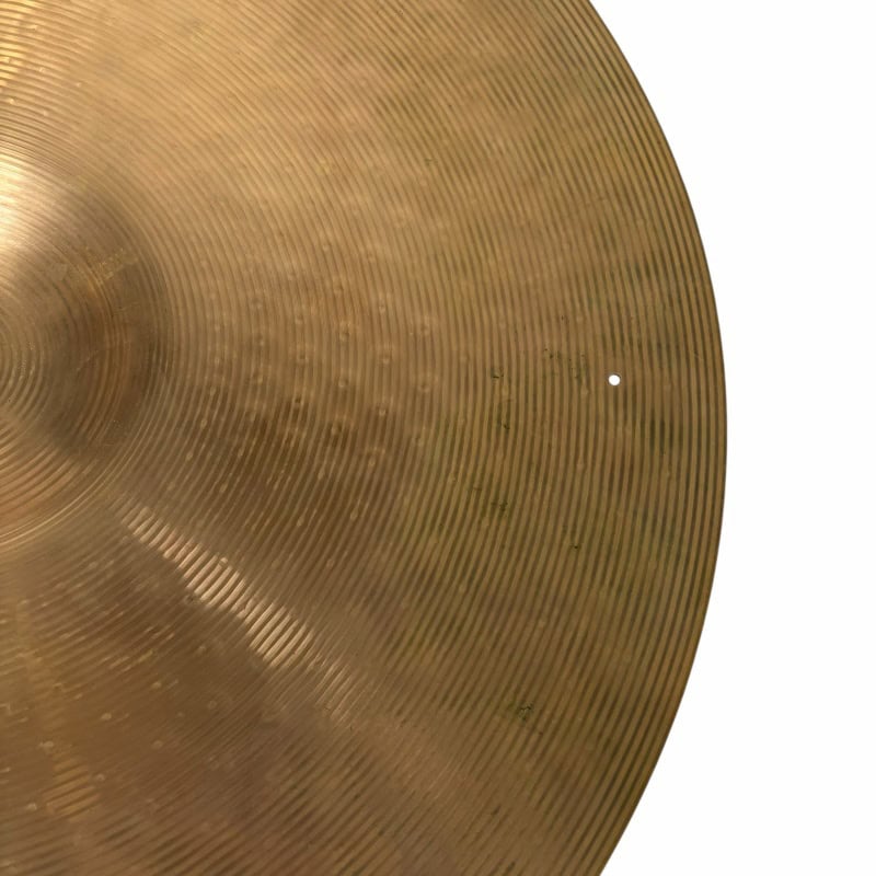 Cymbal close-up showing detailed grooves and metallic finish, ideal for drummers and percussion enth.