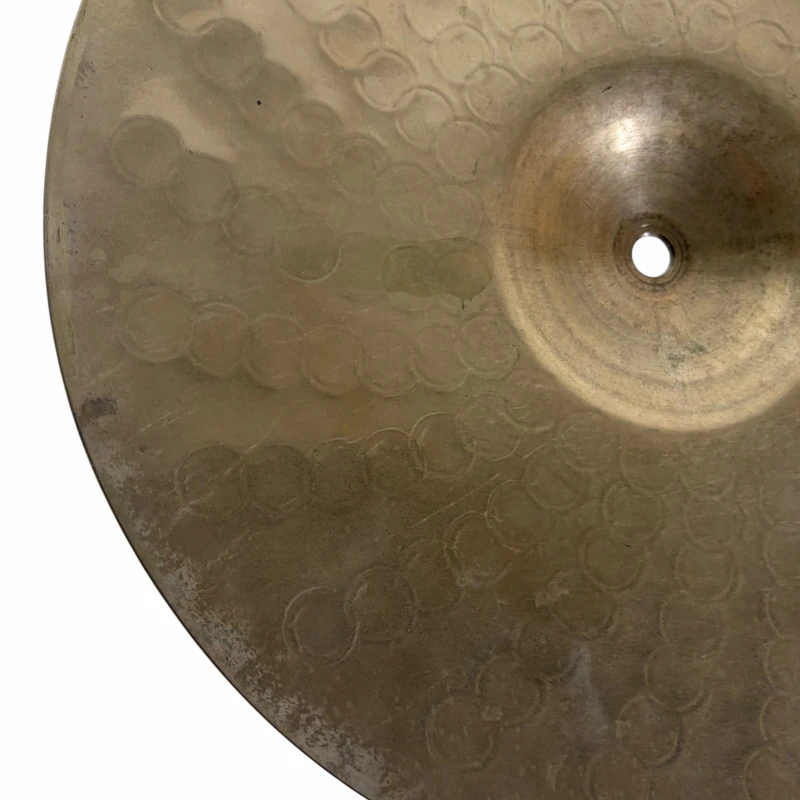 Close-up of a professional drum cymbal with detailed hammering marks.