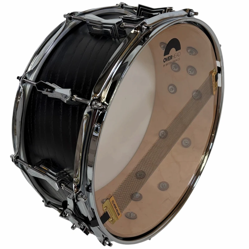 Bass drum with clear drumhead, chrome hardware, and internal muffling for professional sound.