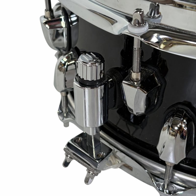 Close-up of professional drum kit hardware and tuning components.